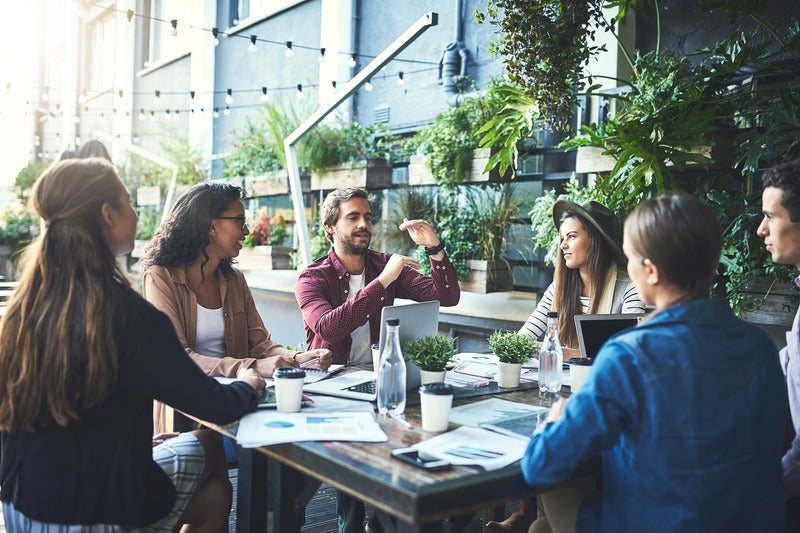 people discussing in cafe